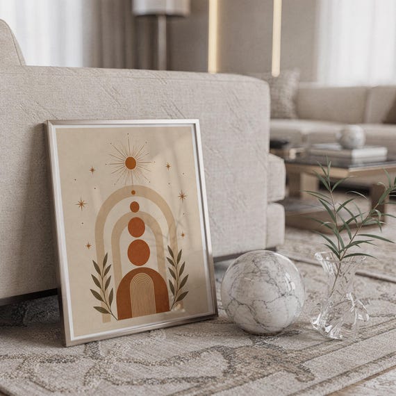 Terracotta geometric arch print framed on carpet floor next to crystal ball decor in home.