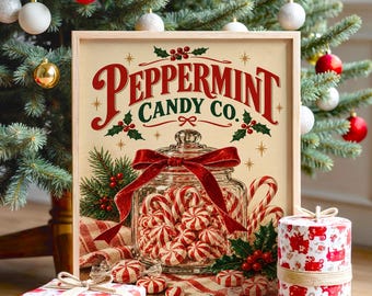 Könnte beinhalten: Ein gerahmtes rechteckiges Schild mit dem Text Peppermint Candy Co. in roter und grüner Schrift. Das Bild zeigt ein Glasgefäß gefüllt mit rot-weiß gestreiften Pfefferminzbonbons, verziert mit einer roten Samtschleife und Stechpalmen.