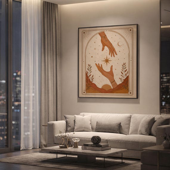 Terracotta spiritual tarot card print framed on wall behind white sofa in spacious modern apartment.