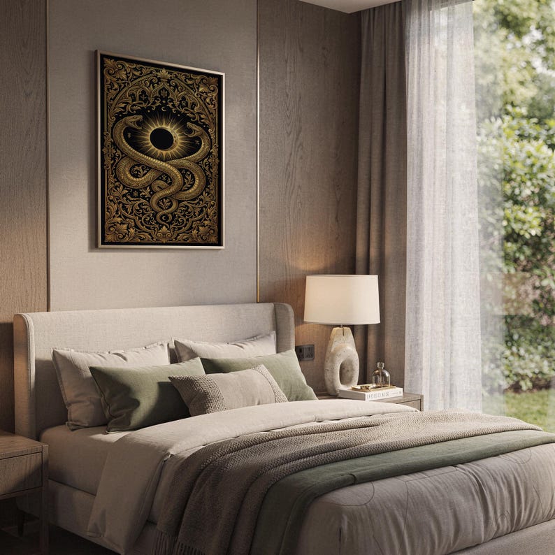 Occult snake wall art print hanging above a bed with sage green pillows in a calm neutral bedroom.