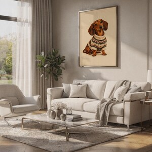 Dachshund sweater wall art print standing on a countertop in a modern white kitchen.