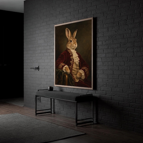 Regal rabbit portrait wall art print hanging in a high-rise apartment living room with a city skyline view.