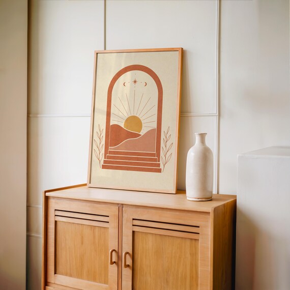 Boho terracotta arch poster set on warm wooden sideboard console cabinet