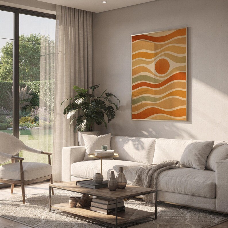 Abstract wavy sun print hanging above a white sofa in a living room with garden views.