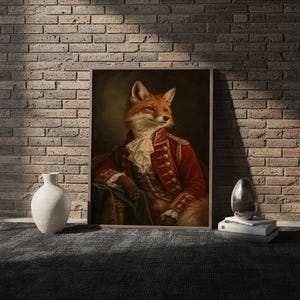Fox portrait wall art print in a white frame leaning against a gray sofa on a sunlit wooden floor.