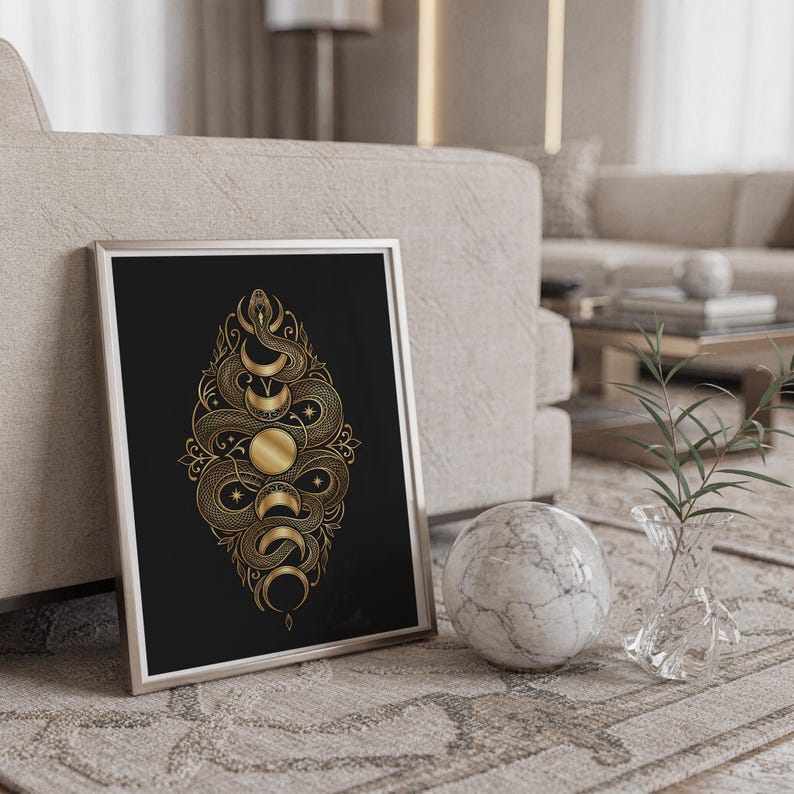 Gold snake moon phase wall art print standing on a countertop in a modern white kitchen.