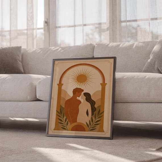 Boho romantic arch print in a light wood frame resting on a soft rug next to a white sofa in a sun-drenched modern apartment.