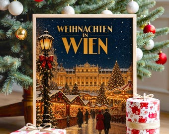 Könnte beinhalten: Ein gerahmter rechteckiger Druck mit dem Titel WEIHNACHTEN IN WIEN, der eine nächtliche Szene eines Wiener Weihnachtsmarktes mit einer beleuchteten Straßenlaterne, einem großen Gebäude und Passanten zeigt, flankiert von zwei weißen Geschenkboxen mit roten Mustern.