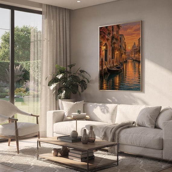 Venice canal sunset wall art print hanging above a white sofa in a living room with garden views.