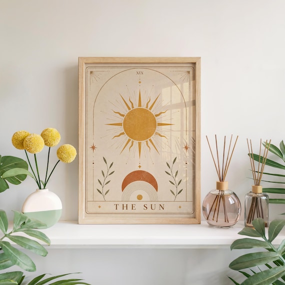 Boho sun tarot card wall art framed poster with yellow flowers and room diffuser on wooden shelf