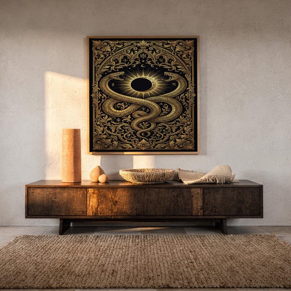 Occult snake wall art print hanging above a dark wood console and jute rug in a warm neutral interior.