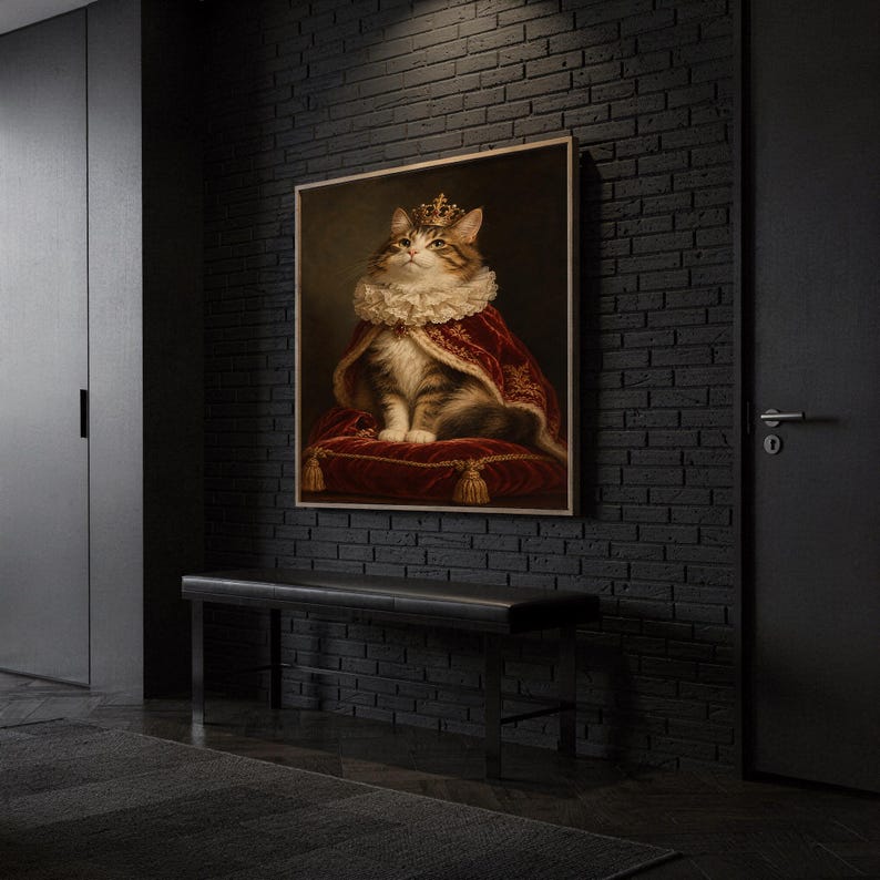 Royal cat portrait wall art print hanging above a dark wood console and jute rug in a warm neutral interior.