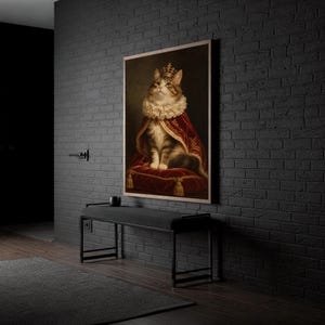 Royal cat portrait wall art print standing on a white kitchen counter beside potted herbs.