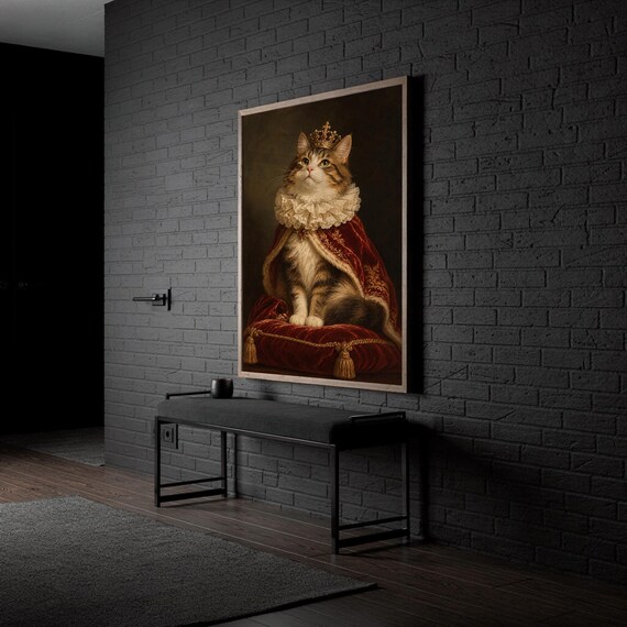 Royal cat portrait wall art print standing on a white kitchen counter beside potted herbs.