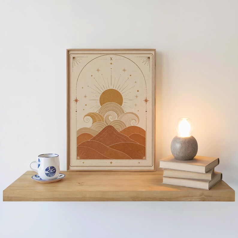 Bohemian landscape art print on wooden floating shelf next to coffee cup and candle.