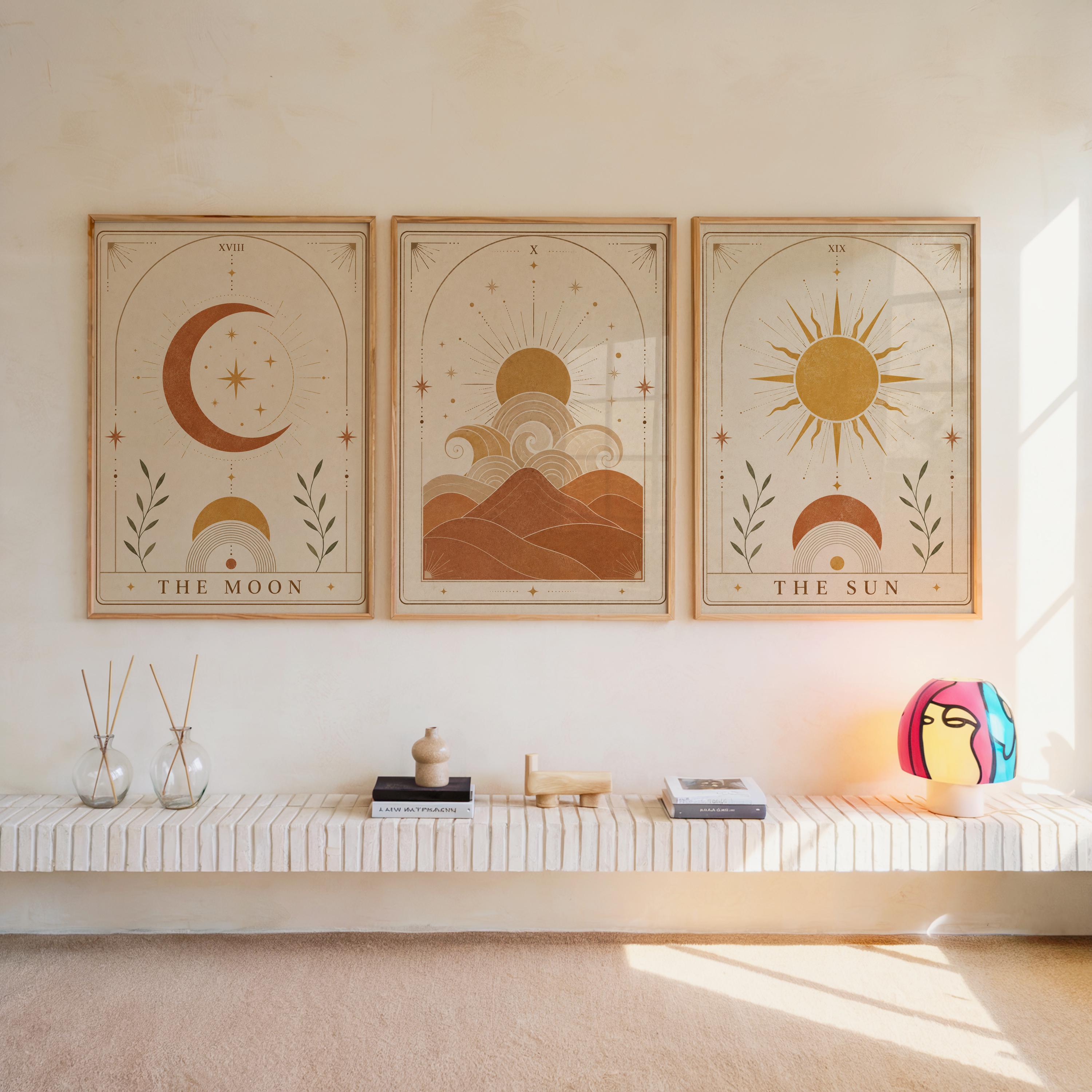 Set of 3 framed celestial wall art prints featuring The Moon, desert dunes, and The Sun hanging above a bench.