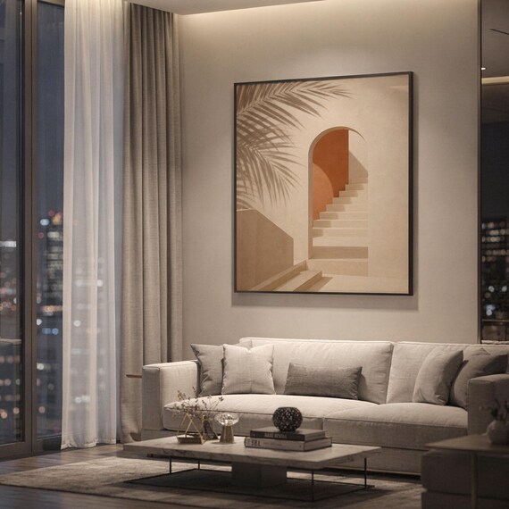 Framed architectural poster hanging in a modern apartment living room with cozy evening lighting.