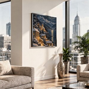 Snowy mountain village wall art print hanging in a high-rise apartment living room with a city skyline view.