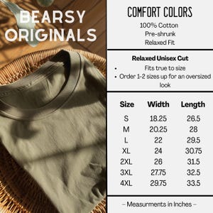 May include: An olive green t-shirt from Bearsy Originals. The image includes text that says "COMFORT COLORS" and "Relaxed Unisex Cut". Size chart shows measurements in inches, with a width of 18.25 inches and a length of 26.5 inches for size S.