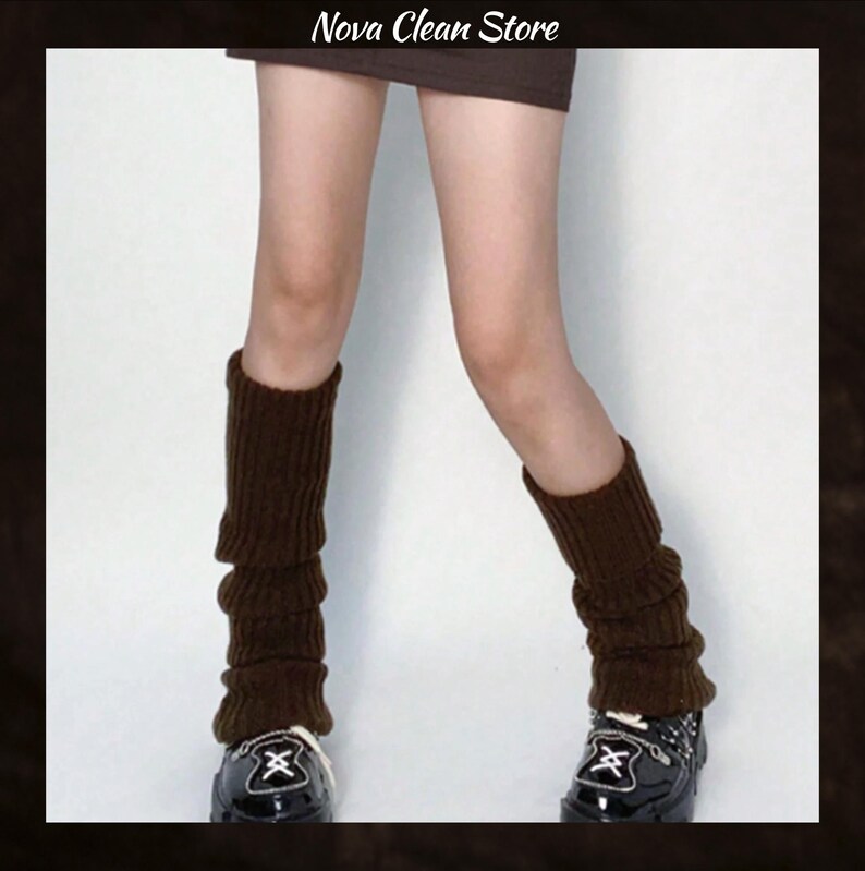 May include: Brown leg warmers made of a ribbed knit material. The leg warmers are worn over black shoes. The text "Nova Clean Store" is at the top of the image.