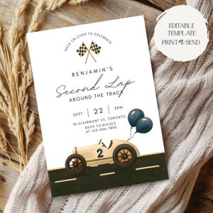 May include: A white invitation card with a vintage race car illustration. The card reads "Benjamin's Second Lap Around the Track" with event details and the text "Race on over to celebrate." Two dark blue balloons are also featured.