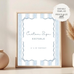 May include: A framed sign with a light wood frame. The sign has a white background with light blue vertical stripes and a decorative border. Text on the sign reads "Custom Sign" and "Editable". The sign is 8" x 10" in size.