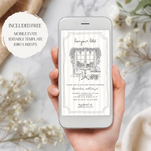 Puede incluir: Un tel&eacute;fono m&oacute;vil muestra una invitaci&oacute;n para un baby shower con el texto "bonjour b&eacute;b&eacute;". La invitaci&oacute;n presenta una ilustraci&oacute;n en blanco y negro de una escena de ventana con una mesa, una silla y un cochecito. El tel&eacute;fono tambi&eacute;n muestra el texto "INCLUDED FREE MOBILE EVITE EDITABLE TEMPLATE 1080 X 1920 PX."