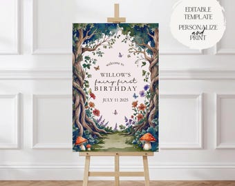 May include: A wooden easel displays a watercolor-style sign with the text "Welcome to Willow's Fairy First Birthday, July 11 2025." The sign features a forest scene with trees, flowers, butterflies, and mushrooms. The sign is a template.