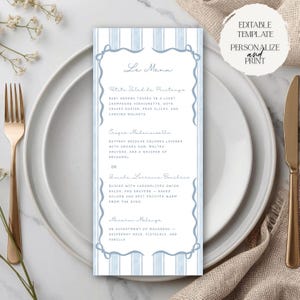 May include: A menu card with a light blue striped design and decorative border, placed on a white plate with a gold fork and knife. The menu includes text for Petite Salad de Printemps, Croque Mademoiselle, Quiche Lorraine Buchies, and Macaron Melange. Text on the top right says "EDITABLE TEMPLATE PERSONALIZE and PRINT."