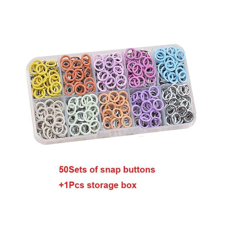 May include: A clear plastic storage box filled with sets of colorful snap buttons. The buttons are arranged in rows of yellow, orange, pink, purple, light blue, gray, green, peach, lavender, and silver. Text on the image reads: "50 Sets of snap buttons +1 Pcs storage box."