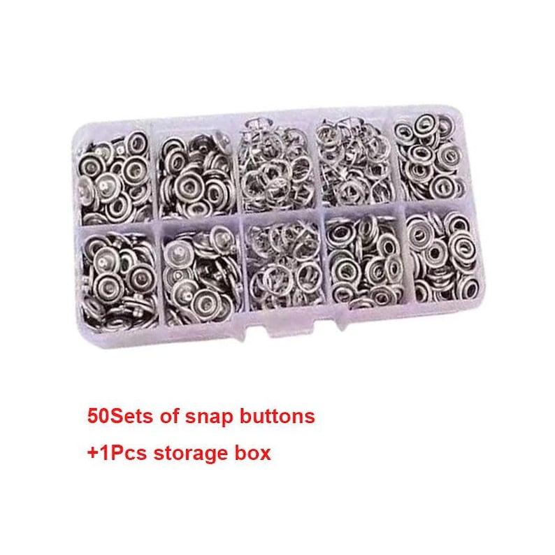 May include: A clear plastic storage box filled with silver snap buttons. The box is divided into ten compartments, each containing a different quantity of the snap buttons. The text "50 Sets of snap buttons +1Pcs storage box" is visible.
