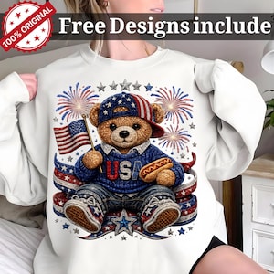 May include: White sweatshirt with a patriotic teddy bear design. The bear wears a USA sweater, a baseball cap, and holds an American flag and a hot dog. The design includes fireworks, stars, and red, white, and blue accents. Text on the top says "Free Designs include".