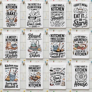 May include: A collection of white kitchen towels with various black text designs and illustrations. The towels feature phrases like "In this kitchen we bake with love" and "Eat it or starve." The towels are decorated with kitchen-themed graphics.