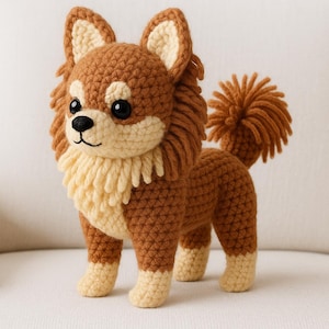 May include: A handmade crochet dog figurine in shades of brown and cream. The dog has large, dark eyes, a fluffy mane, and a tail. The dog is standing on all fours, showcasing its detailed craftsmanship.