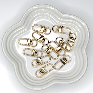 Shiny silver and gold 12x33mm swivel lobster clasps for keychains, bag charms, jewelry making, and DIY craft supplies.