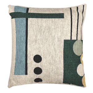 May include: Square decorative pillow with a cream-colored background and an abstract geometric design. The design includes teal, dark green, and black shapes, along with three black circles and vertical black lines. The pillow has a textured appearance.