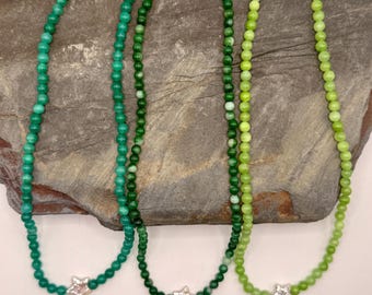 Beachy chokers: turquoise and green beaded chokers with pearl star