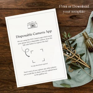 May include: A white paper with the text "Disposable Camera App" and a camera illustration. The text explains how to use a phone as a disposable camera. The words "Print or Download your template" are at the top. The paper is on a wooden surface.