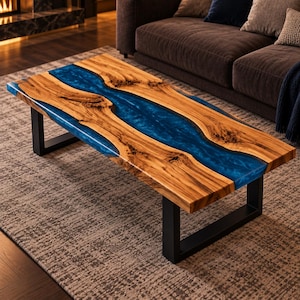 May include: A rectangular coffee table featuring a natural live-edge wood slab with a prominent central river of translucent blue resin. The table is supported by two sturdy black metal U-shaped legs, showcasing a contrast between the wood grain.