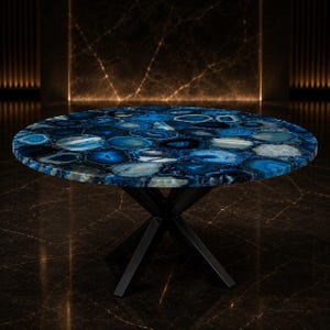 Designer lounge furnishing with polished gemstone mosaic surface and architectural metal support.
Exclusive handcrafted blue agate furniture piece created for contemporary and luxury interiors.