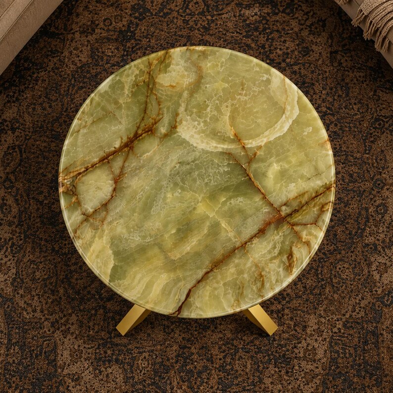 Handmade round onyx table top with organic brown veins and smooth polished surface
Natural green onyx furniture centerpiece styled with contemporary gold metal stand