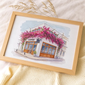 May include: Watercolor painting of a coffee shop with a light wood frame. The shop is white with large windows and a wooden door. Pink flowers cascade over the building. The word "COFFEE" is above the door.