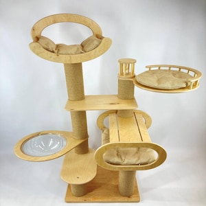 Tall modern cat tree with scratchers, bed, and shelves. Perfect cat furniture for climbing, playing, and cozy naps.