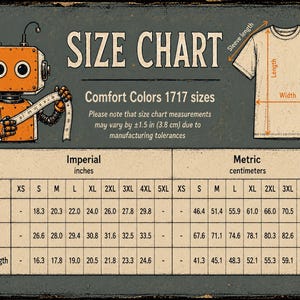Peut inclure: Un tableau des tailles Comfort Colors 1717 avec un robot orange tenant un ruban &agrave; mesurer. Le graphique inclut un sch&eacute;ma de t-shirt avec la largeur, la longueur et la longueur des manches, ainsi qu'un tableau des mesures en pouces et centim&egrave;tres.