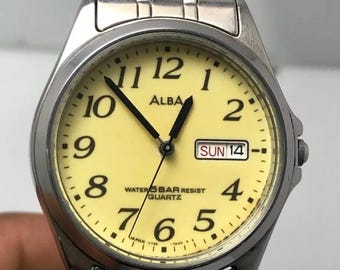 Reloj de pulsera vintage Seiko Alba V733-7A00 de cuarzo japonés con día y fecha para hombre