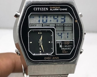 May include: A vintage Citizen Digi-Ana watch with a silver metal strap and case. The black watch face displays time digitally and analogically. The watch has function buttons and the text "CITIZEN CHRONO ALARM-CHIME" is visible. The watch band is approximately 20 cm.