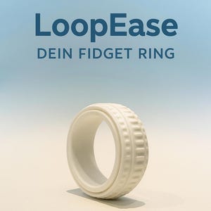 Könnte beinhalten: Ein weißer Fidget-Ring mit strukturiertem Design. Der Ring hat eine glatte, abgerundete Innenseite und eine detaillierte Außenseite. Das Bild enthält den Text "LoopEase" und "DEIN FIDGET RING" in Blau.