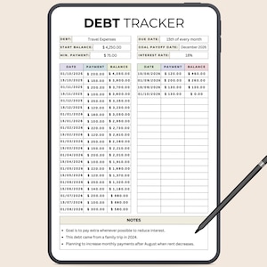 May include: A digital debt tracker on a tablet, with a black stylus. The screen displays a table with dates, payments, and balances. The text "DEBT TRACKER" is at the top. The tablet is on a beige background.