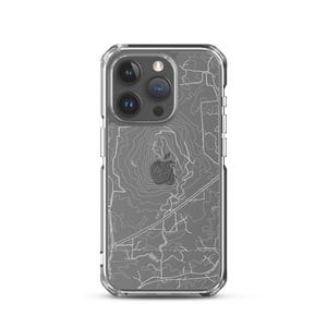 May include: Clear phone case with a gray topographic map design. The map features white contour lines and road details, creating a detailed and artistic look. The case is designed to fit a smartphone.