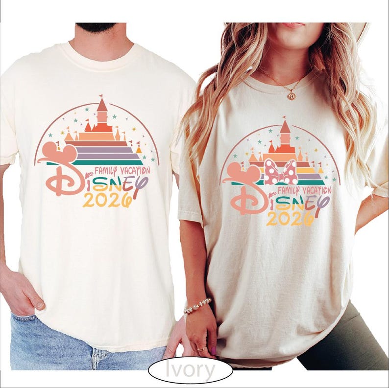 A man and a woman wearing matching Disney vacation t-shirts with a castle and Mickey Mouse design.